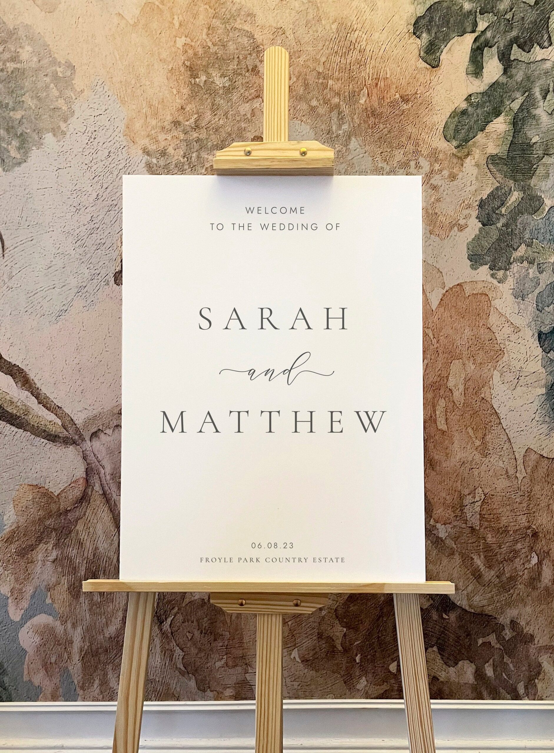 Minimal white personalised wedding welcome sign, grey calligraphy script