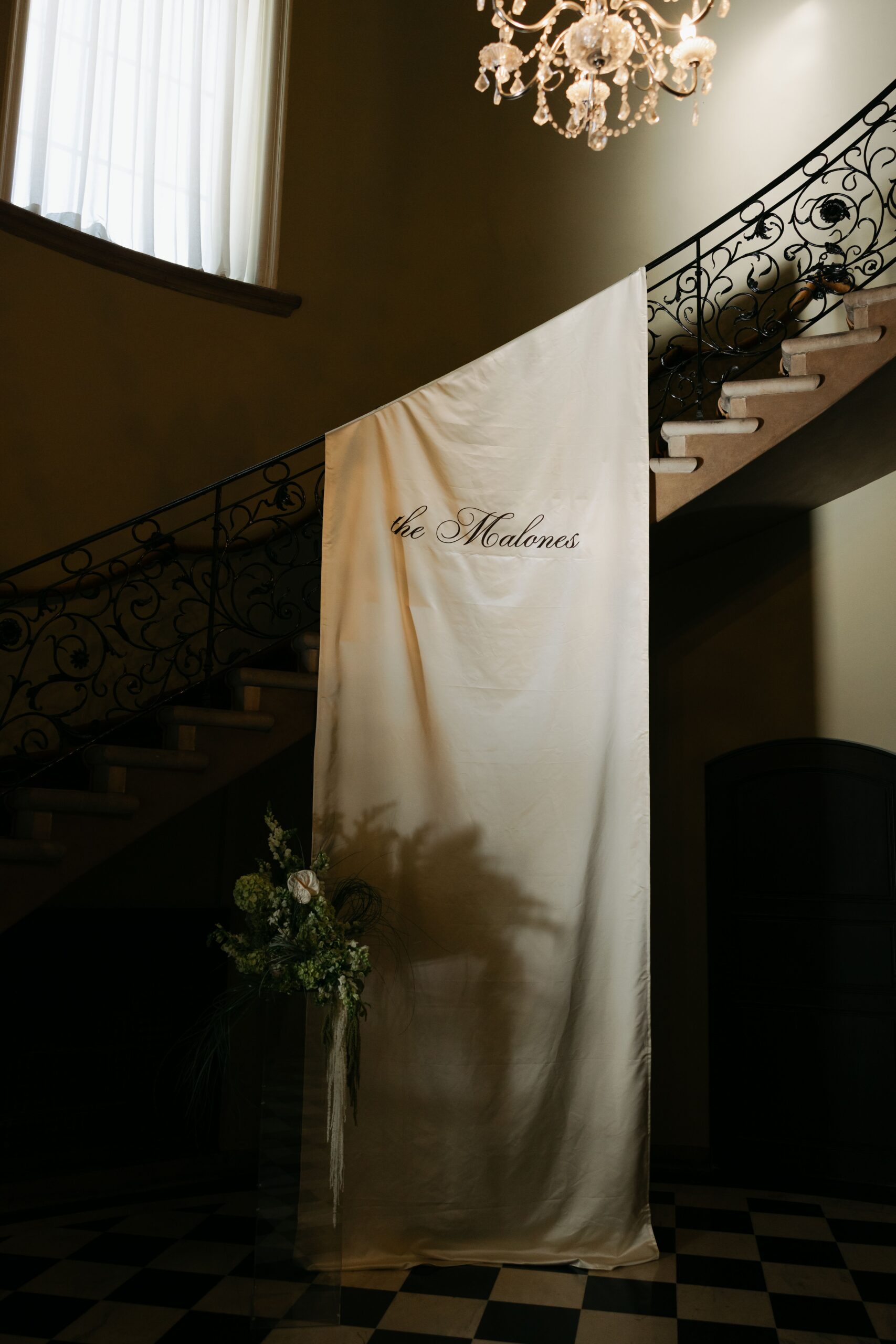 Wedding welcome sign the Malones simple elegant fabric satin on stairs