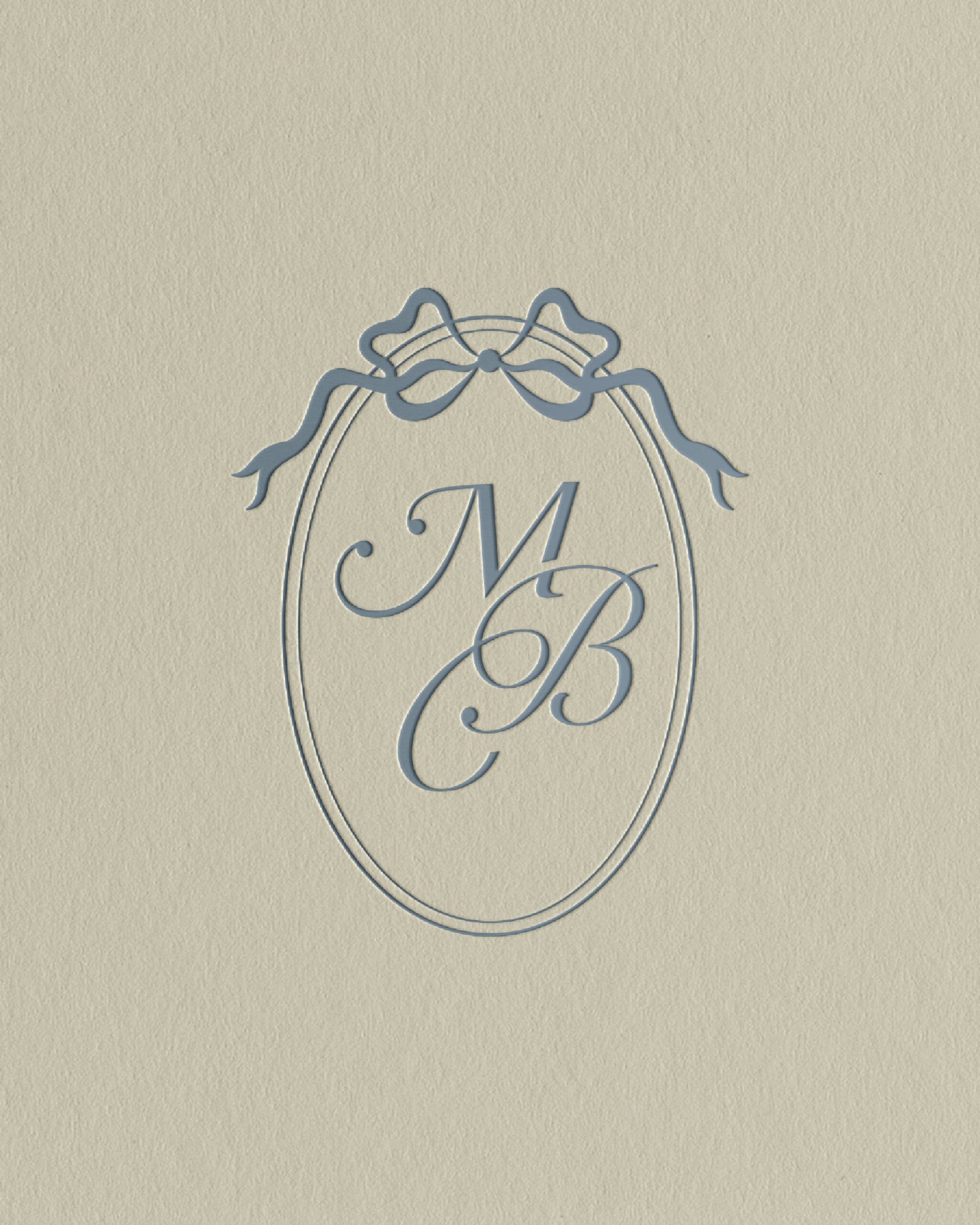 feminine monogram design with script type and bow