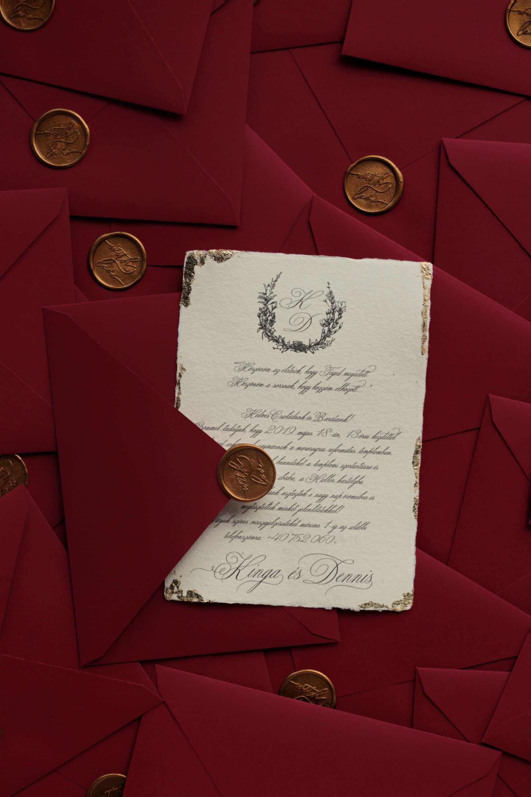 Gold leaf romantic wedding invitations on handmade paper  with burgundy envelopes and gold wax seal