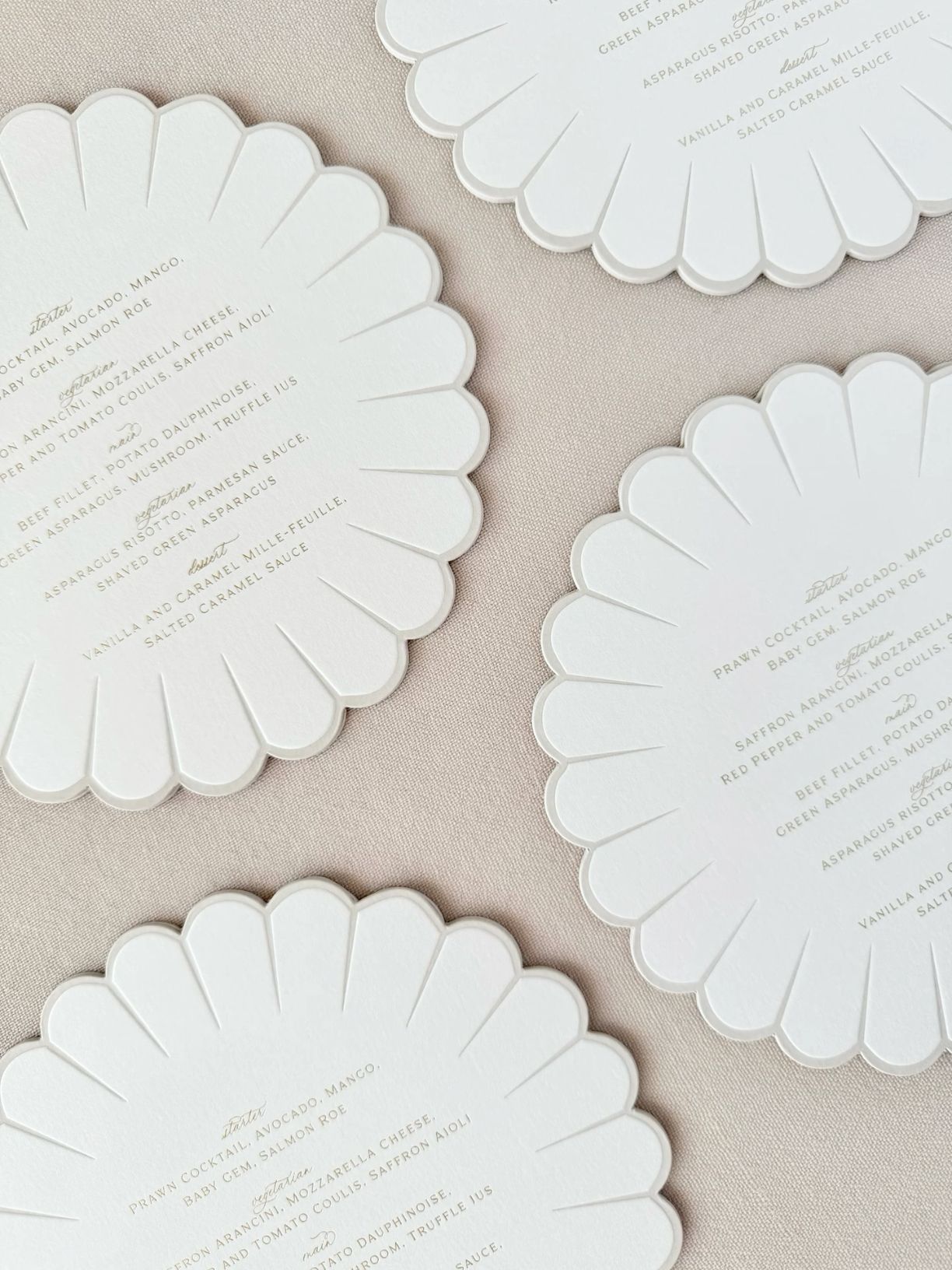 Wavy edge wedding menus with gold hot foil and letterpress